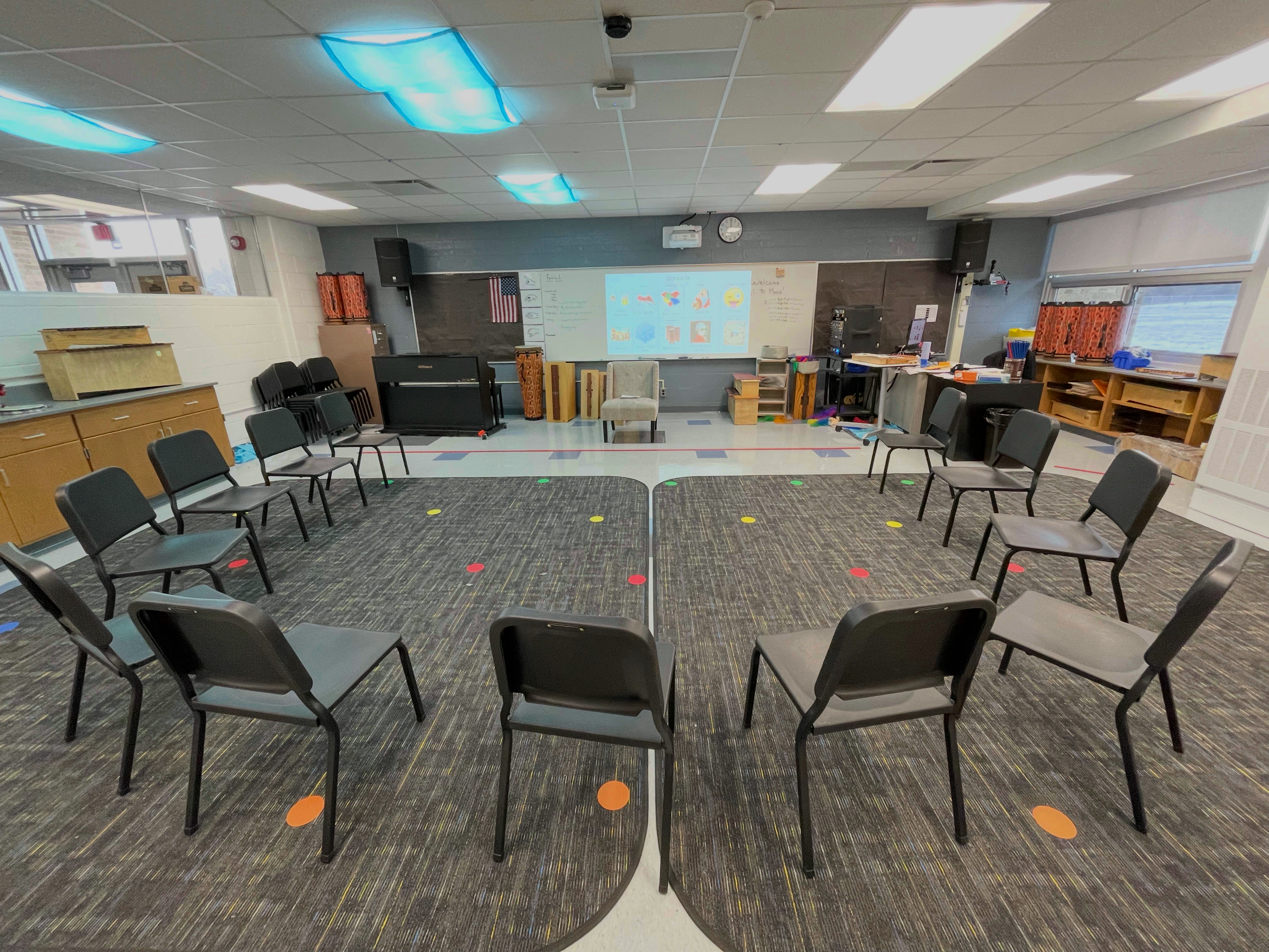 photograph of a classroom with chairs in a semicircle